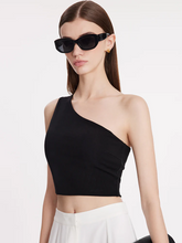 a lady in black asymmetrical one-shoulder top with sunglasses